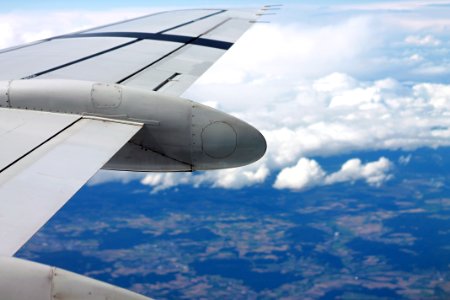 Airplane Wing In Blue Skies