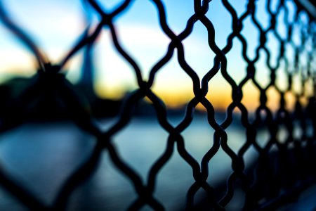 Close Photography And Tilt Lens Of Black Chain Link Fence photo