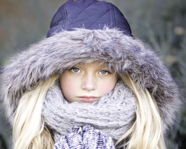 Blond Haired Girl In Purple Winter Jacket