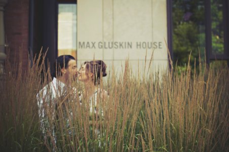 Man And Woman Kissing Near Green Plants photo