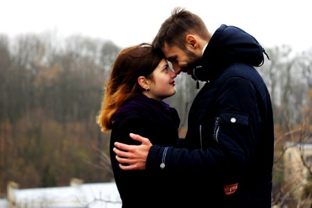 Young Couple On Woman During Winter