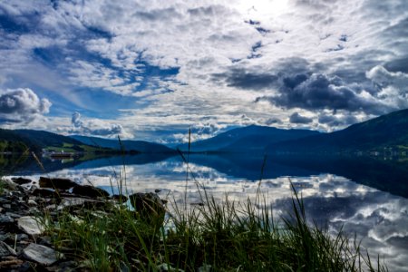 Clouds Reflecting In Alpine Lake photo