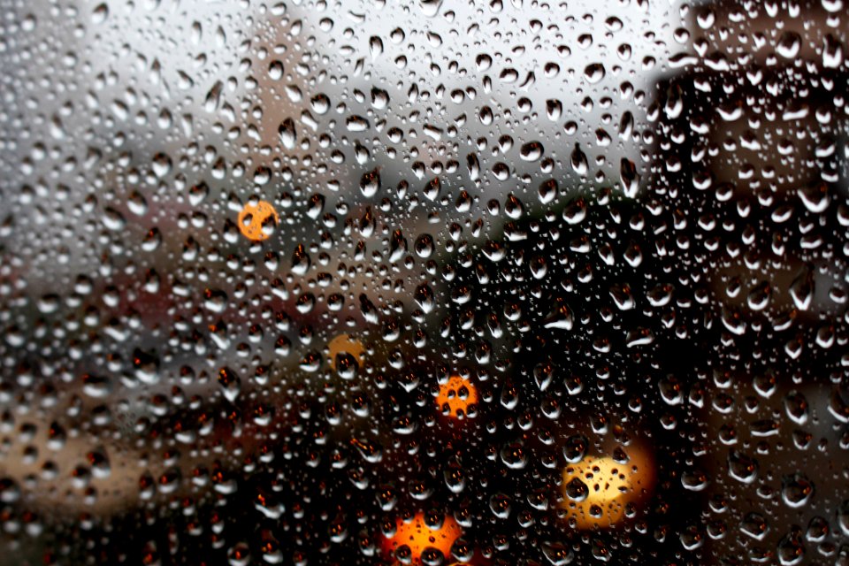 Full Frame Shot Of Raindrops On Glass Window