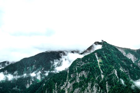 Fog Over Snowy Mountain Peaks