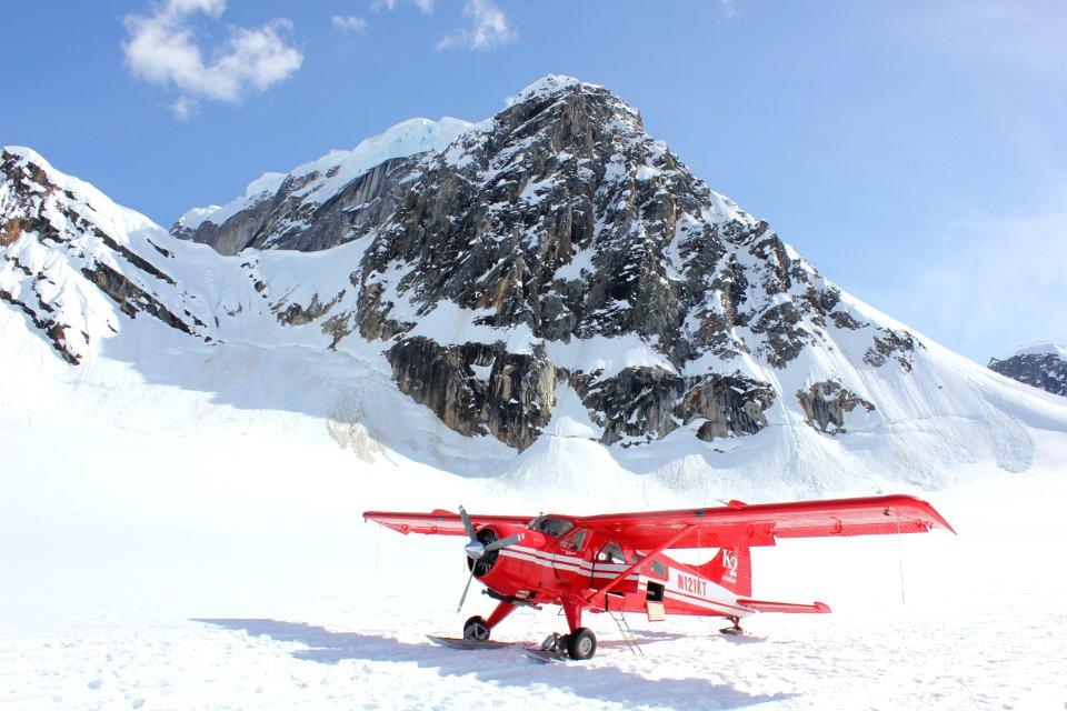 Biplane On Snowy Mountain