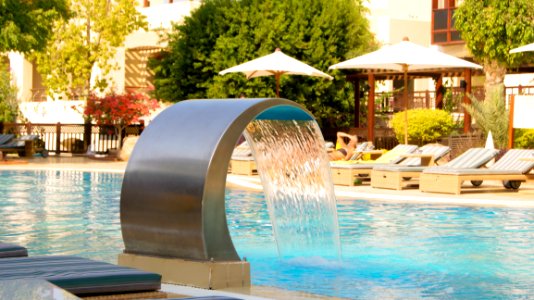 Hotel Swimming Pool With Water Fountain photo