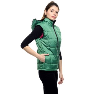 Woman Wearing A Green Puffer Vest And A Black Pants photo