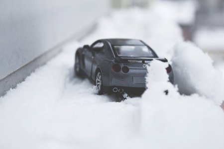 Close-up Photo Of Toy Car On Snow photo