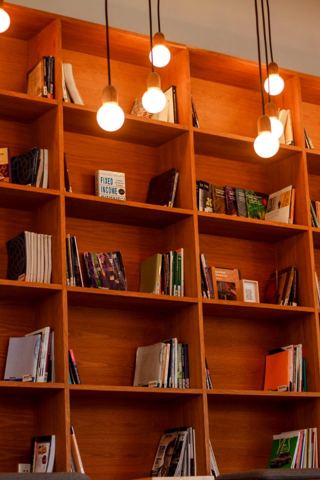 Books On Wooden Shelves