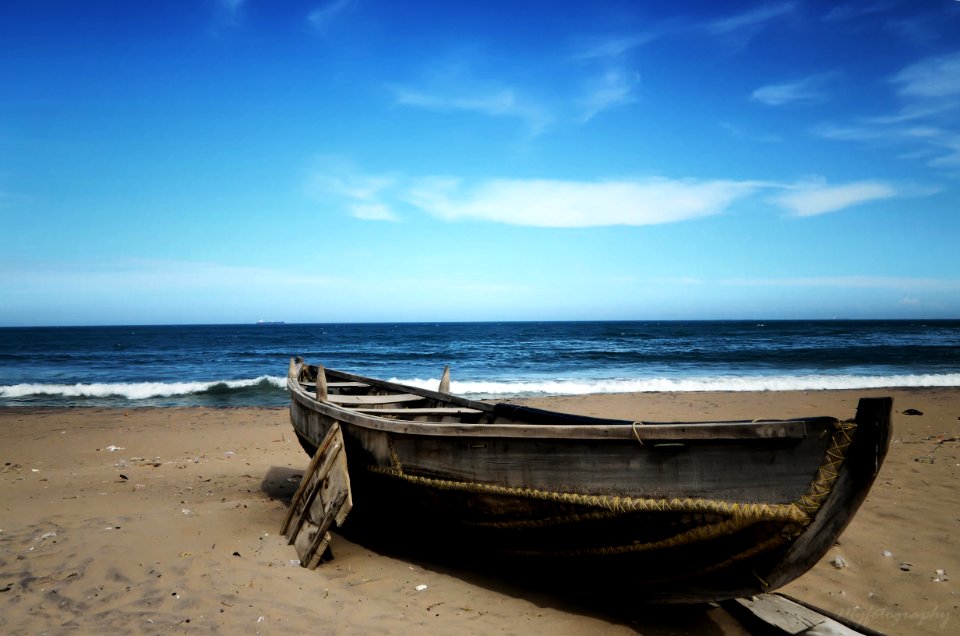 Wooden Boat On Beach