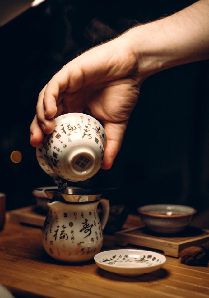 White Ceramic Saucer On Brown Wooden Table