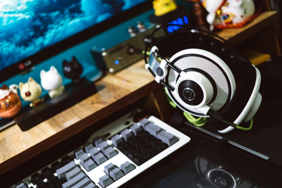 Black And White Headset Next To White Black And Gray Computer Keyboard photo