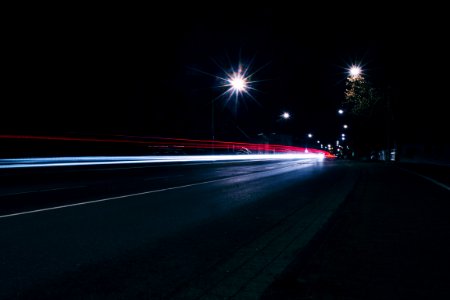 Car Headlights Approaching At Night