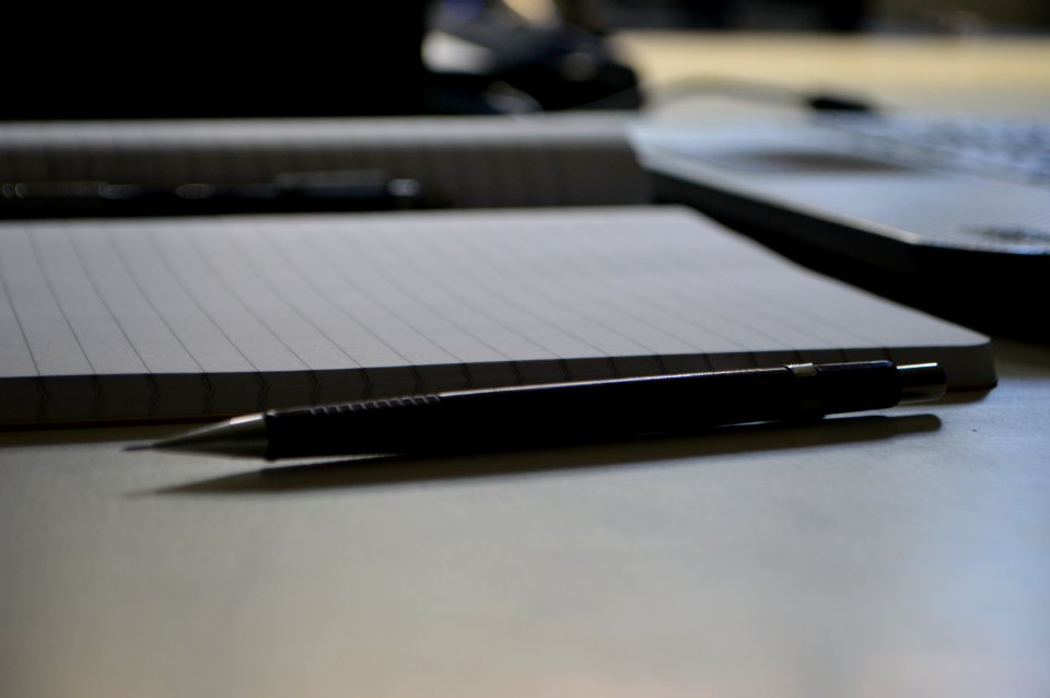 Black Point Pen Beside Ruled Paper