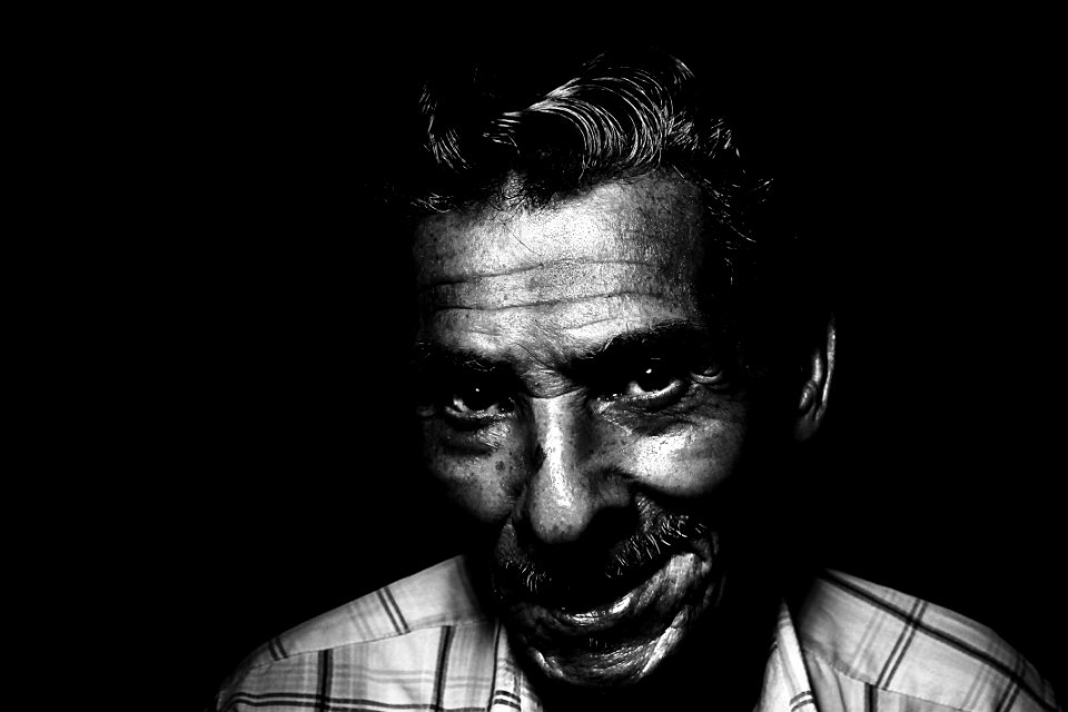 Grayscale Photo Of Man Smiling