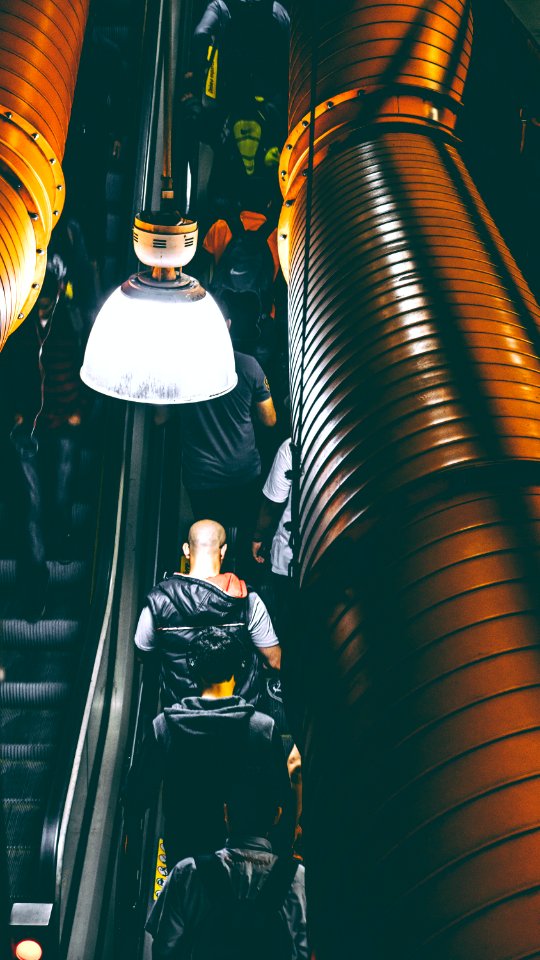 Photo Of People Using Escalator Inside A Building