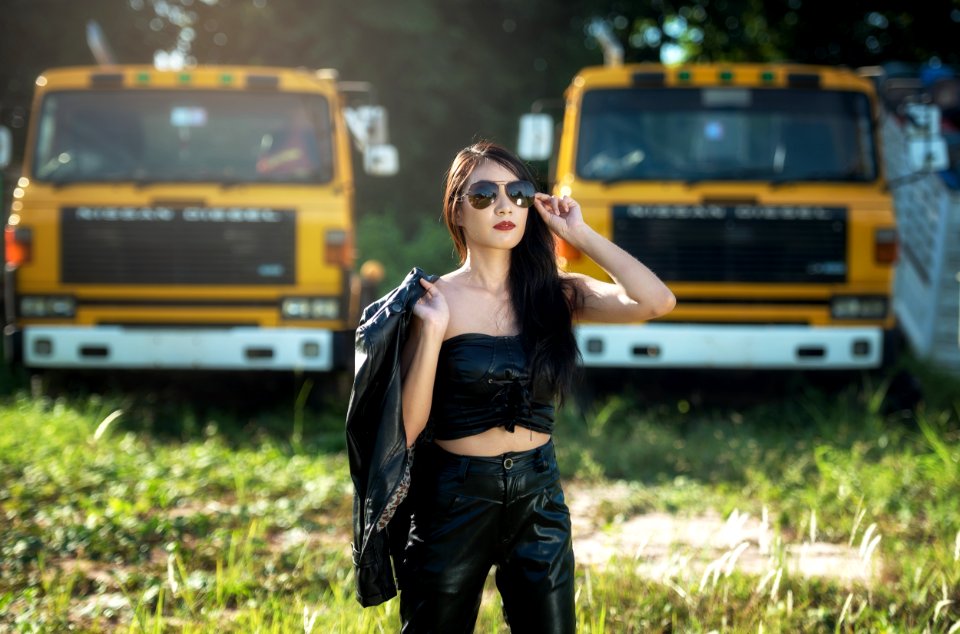 Portrait Of Woman With Trucks