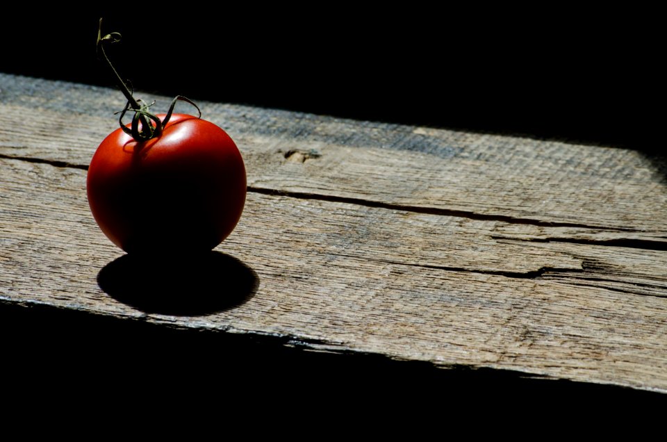 Tomato On Wooden Plank