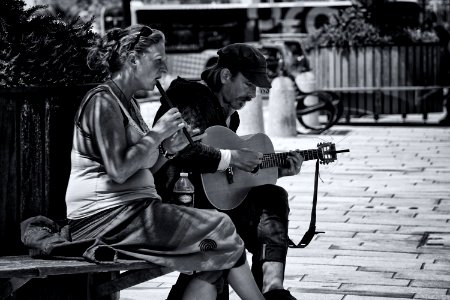 Greyscale Photography Of Man And Woman Playing Musical Instruments