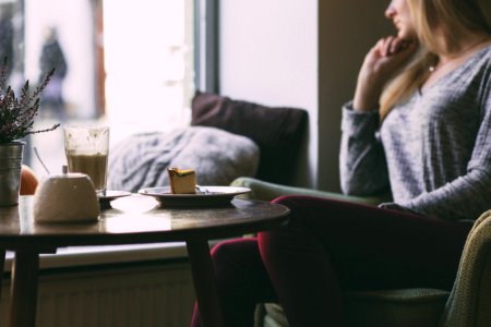 Photography Of Woman Near Round Table During Daytime photo