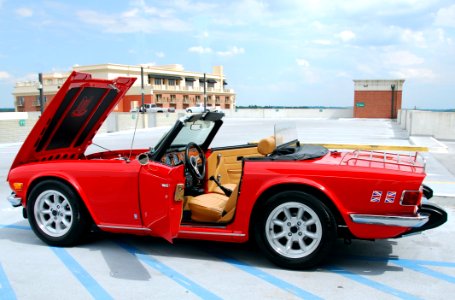 Red Sports Car On Garage Roof photo
