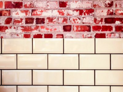 White Ceramic Wall Tile Beside Red Concrete Bricks photo