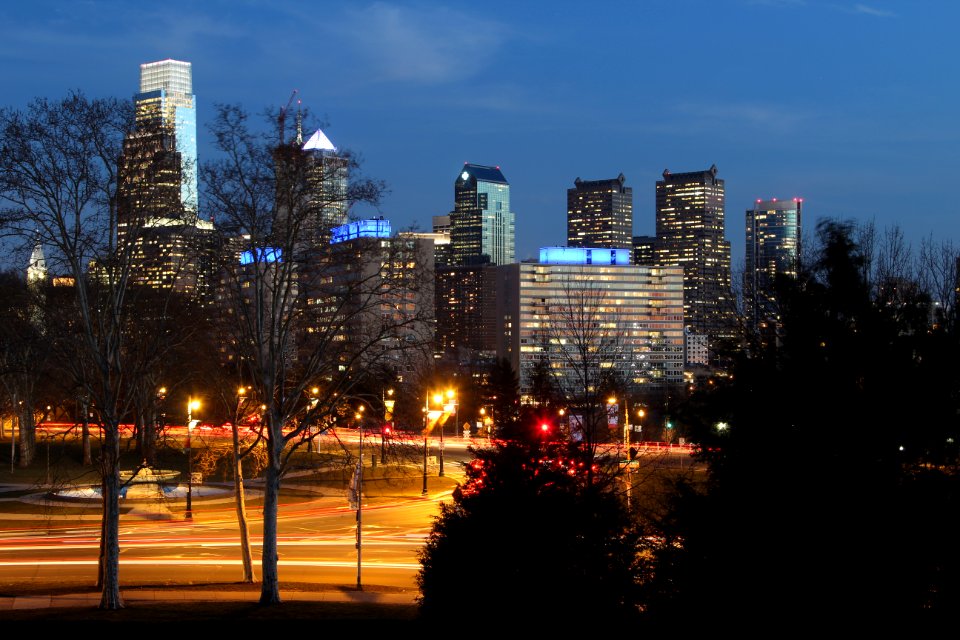City Buildings Near The Road Beside Trees