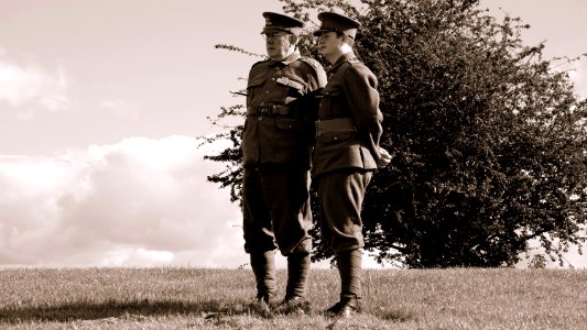 Two Soldier Standing On Grass During Daytime