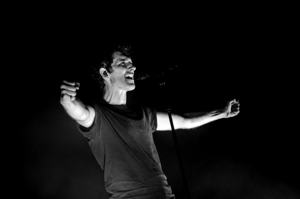 Greyscale Photo Of Man Singing photo