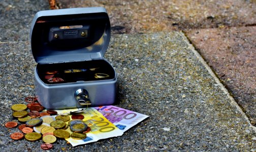 Lock Box With Bills And Coins photo