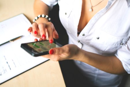 Woman In White Button Up Top And Holding Black Android Smartphone