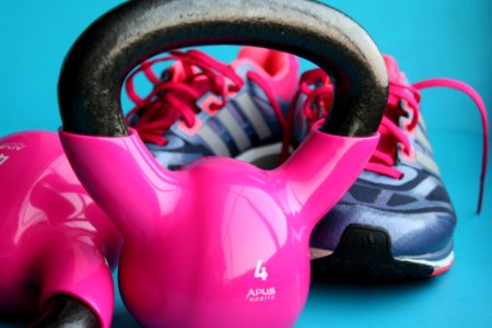 Kettle Bell Beside Adidas Pair Of Shoes photo