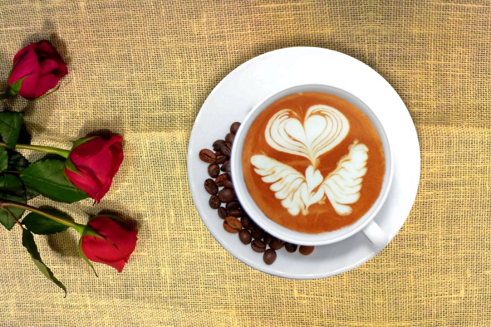Cup Of Coffee In Distance With Red Rose