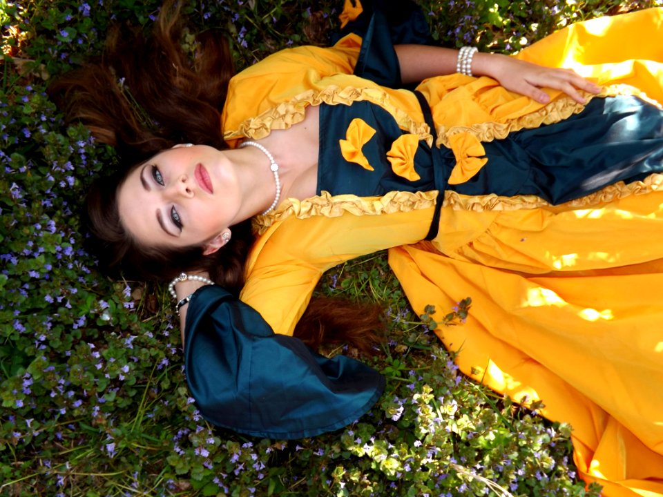 Yellow Dressed Woman On Green Leafed Plant