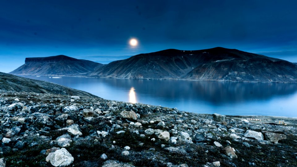 Island Mountain Near Rock Formation During Night Time photo