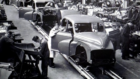 Gray Scale Photo Of Car Factory