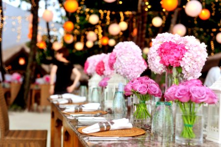 Table With Plates And Flowers Filed Neatly Selective Focus Photography