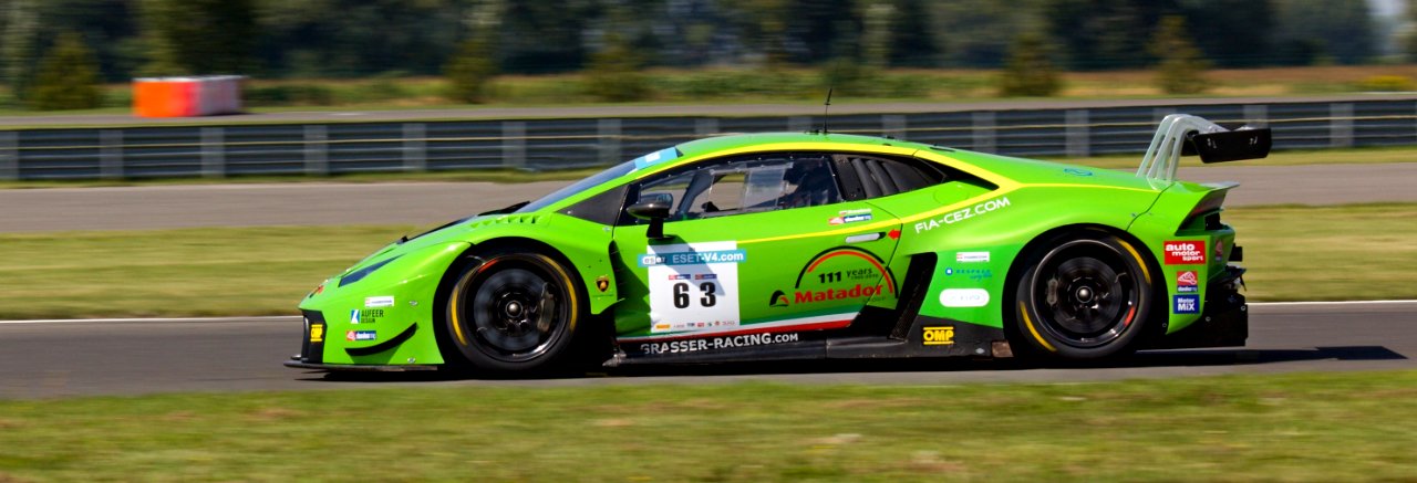 Green Sports Car On Gray Asphalt Road