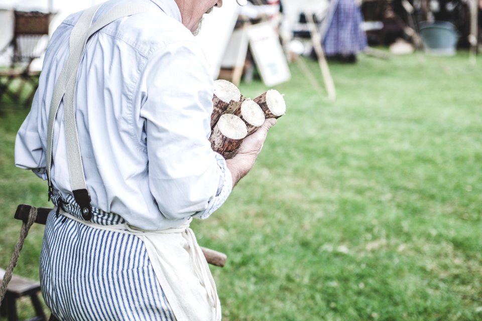 Man In White Dress Shirt Carrying Brown Wood Logs