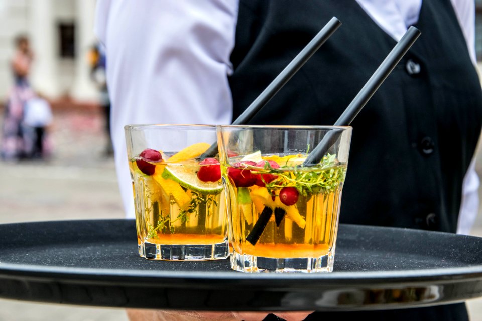 2 Whisky Glasses Filled With Beverage On Black Tray