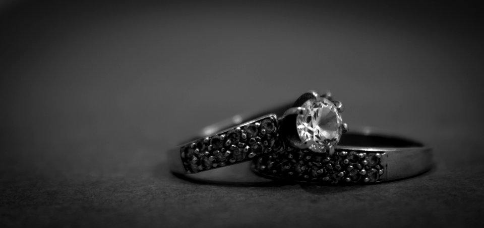 Grayscale Photo Of 2 Silver With Diamond Rings