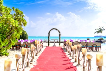 Beach Wedding Event Under White Clouds And Clear Sky During Daytime