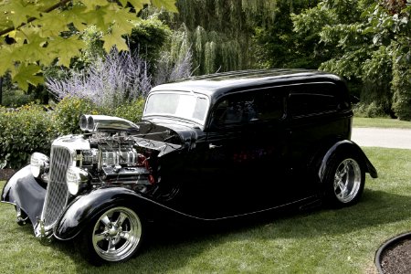 Black Classic Car In Green Grass During Daytime photo