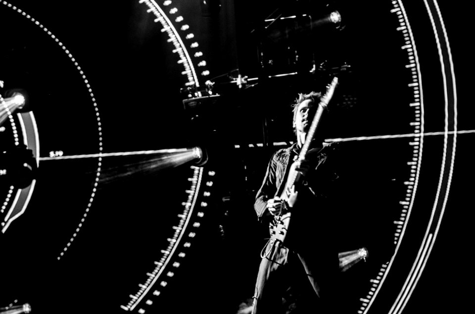 Greyscale Photography Of Man Playing Guitar