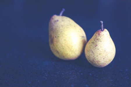 Tilt Shift Photo Of Two Pears