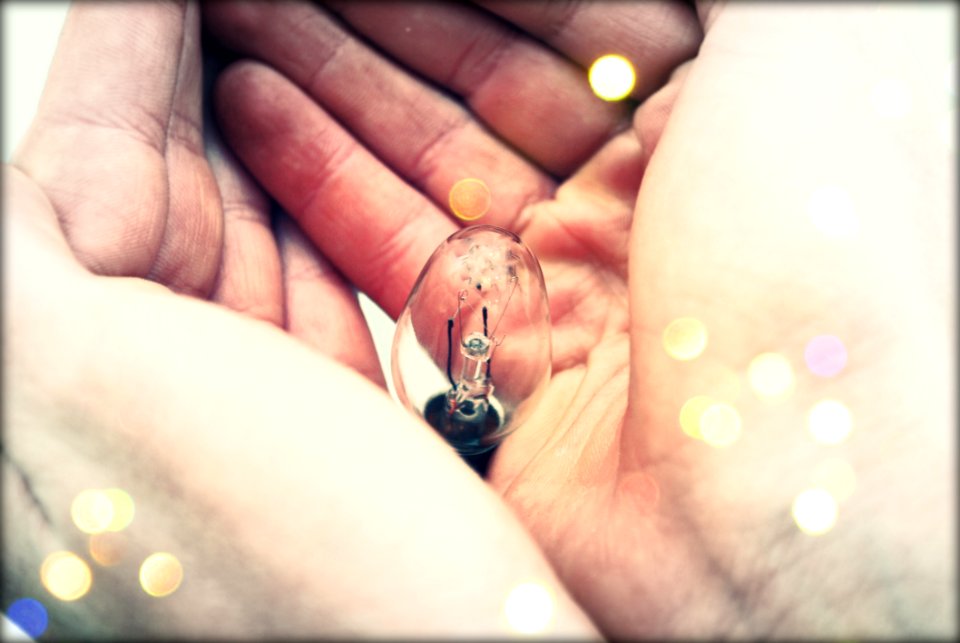Centered Clear Bulb On Human Hand