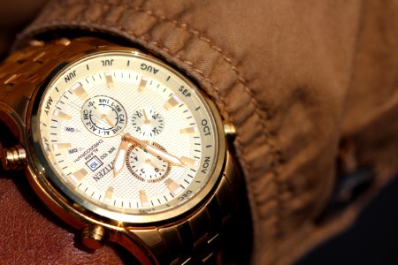 Person Wearing Silver Linked Chronograph Watch photo