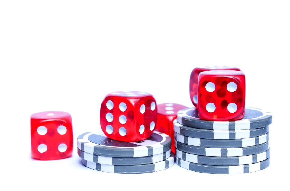 3 Red Dices With Grey And White Poker Chips