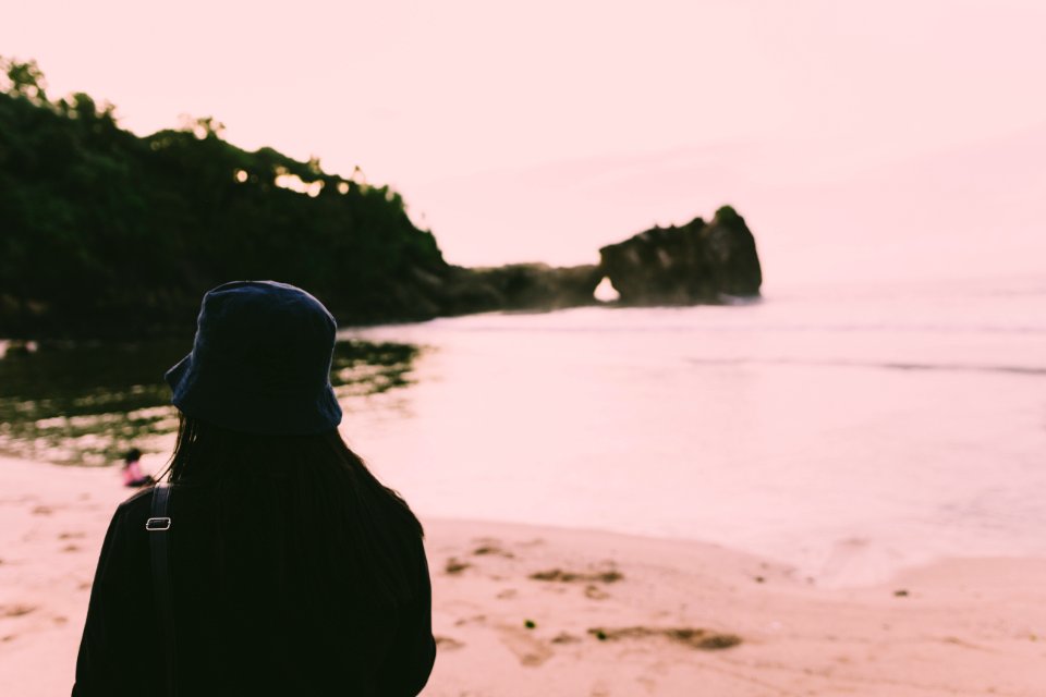 Silhouette Of Person Standing On Seashore During Daytime