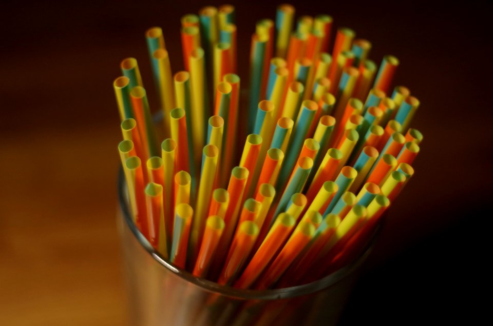 Colorful Plastic Straw On A Glass Container